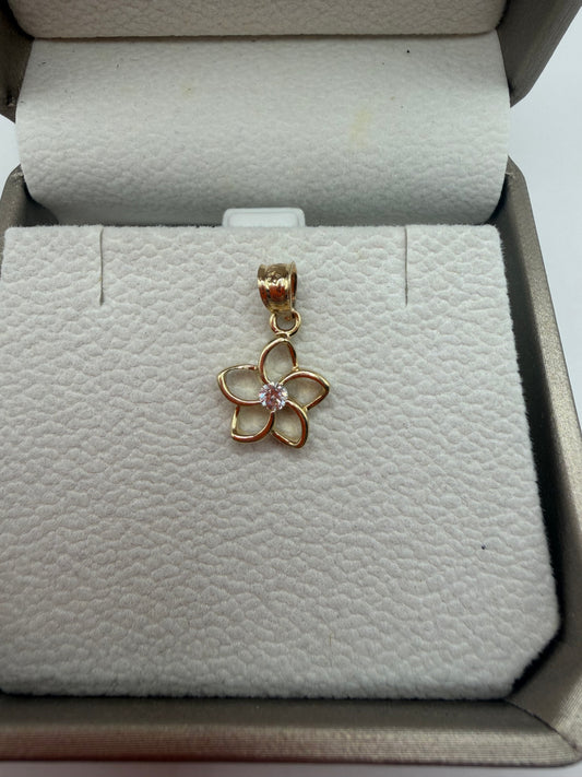 "Dije flor con circonita en oro de 14k"